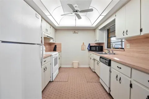 a kitchen with stainless steel appliances a refrigerator and a sink
