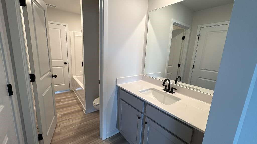 2666 Harbor Rdg Pass Gainesville, GA 30507 - Photo 22 of 41 a bathroom with a sink a mirror and a shower
