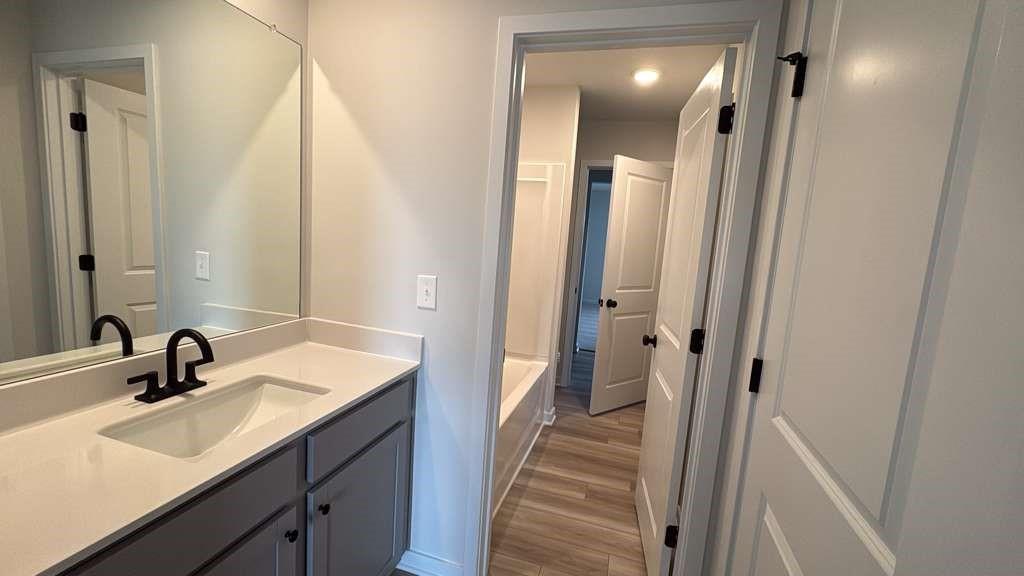 2666 Harbor Rdg Pass Gainesville, GA 30507 - Photo 23 of 41 a en suite bathroom with a sink a mirror and a shower