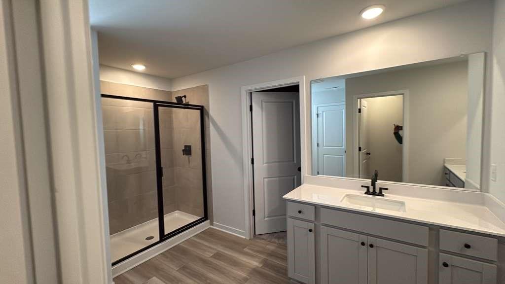 2666 Harbor Rdg Pass Gainesville, GA 30507 - Photo 28 of 41 a bathroom with a double vanity sink and mirror