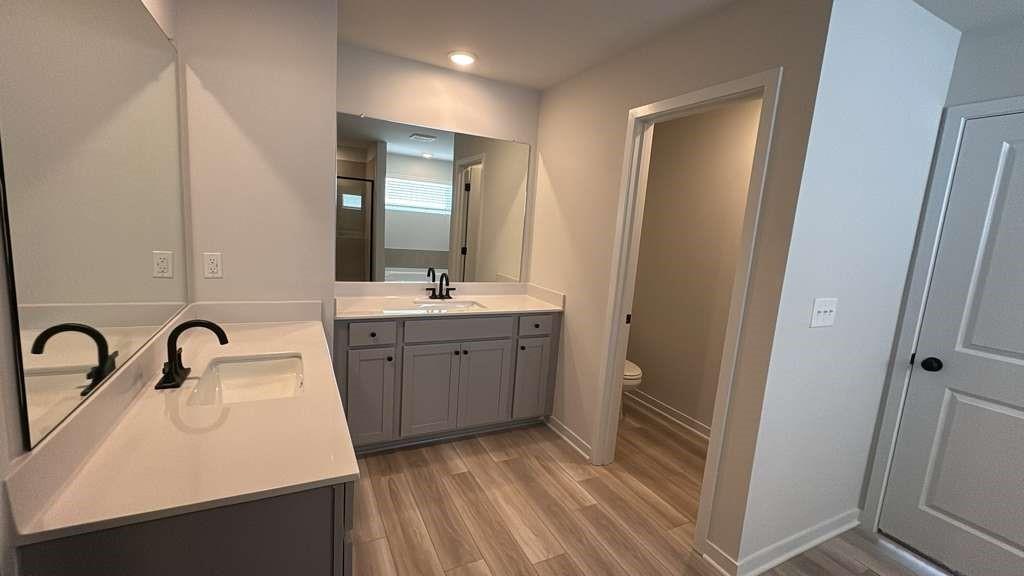 2666 Harbor Rdg Pass Gainesville, GA 30507 - Photo 29 of 41 a bathroom with a sink double vanity and a mirror