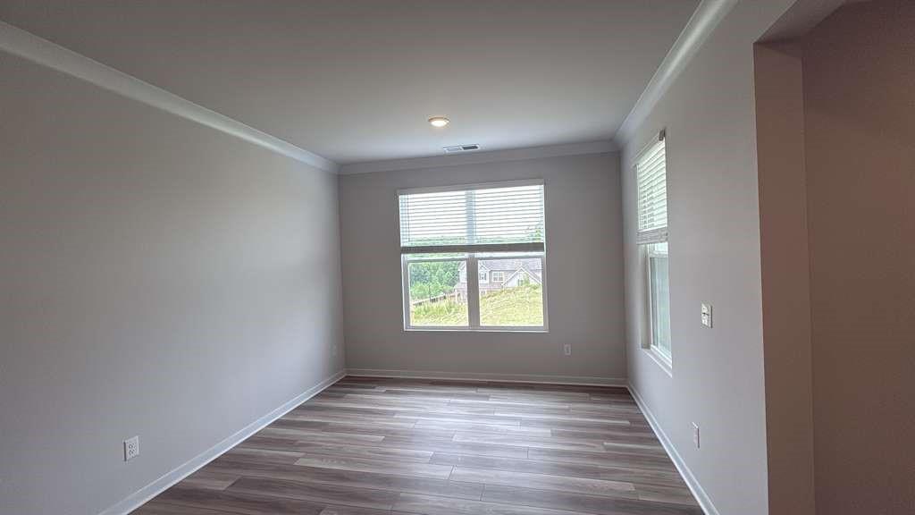 2666 Harbor Rdg Pass Gainesville, GA 30507 - Photo 36 of 41 a view of an empty room with wooden floor and a window