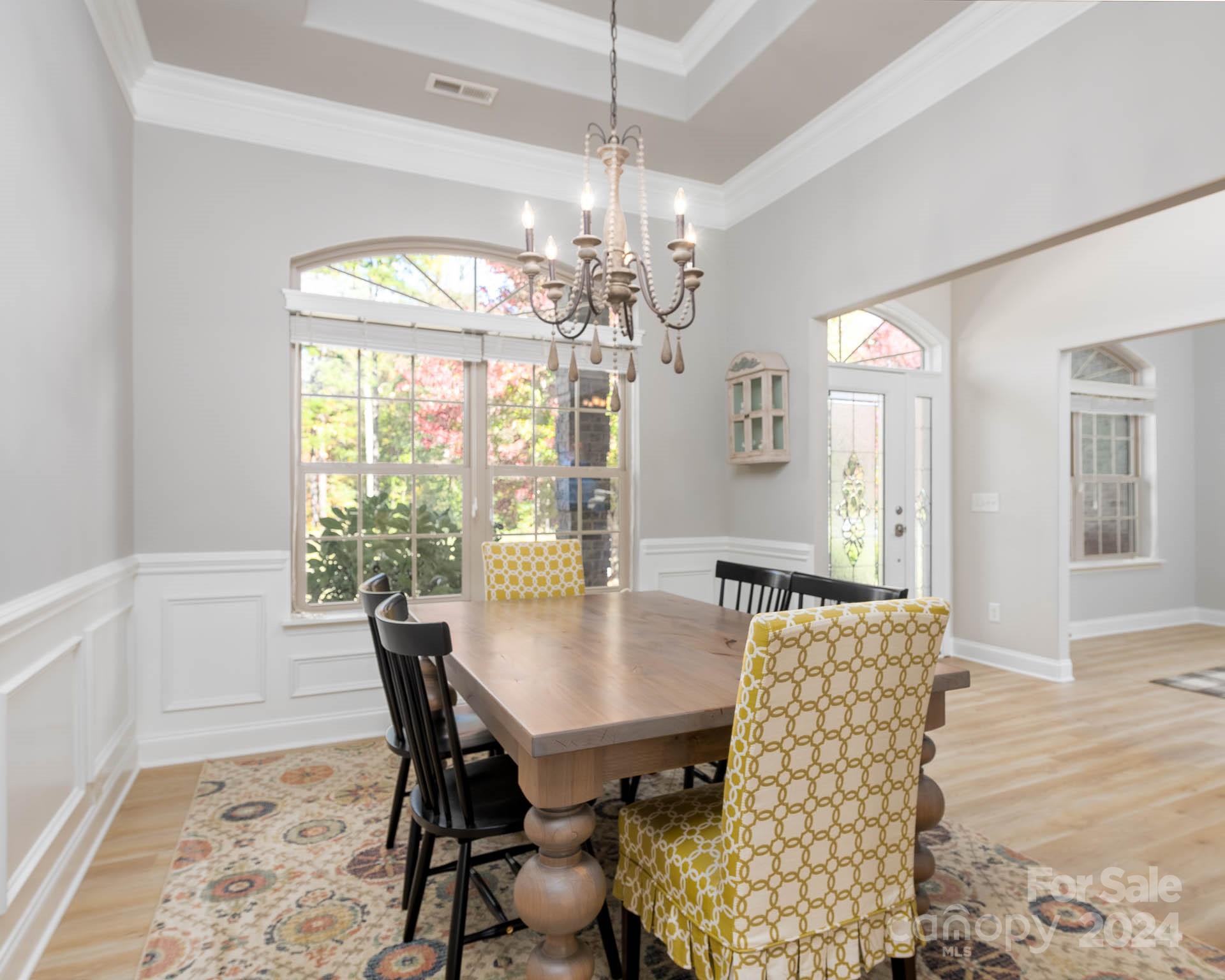 706 Houston Road Troutman, NC 28166 - Photo 13 of 39 a view of a dining room with furniture window and wooden floor