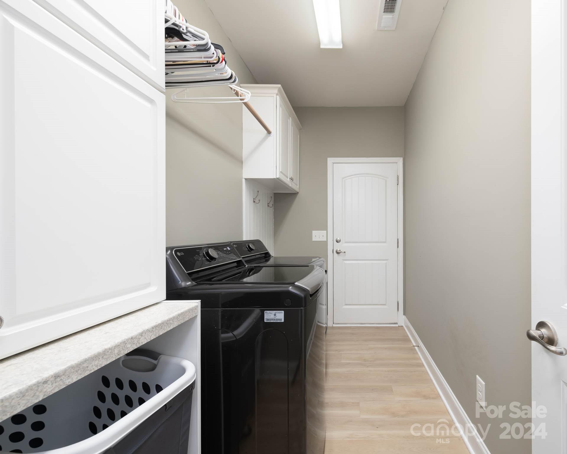 706 Houston Road Troutman, NC 28166 - Photo 14 of 39 a kitchen with a stove and a refrigerator