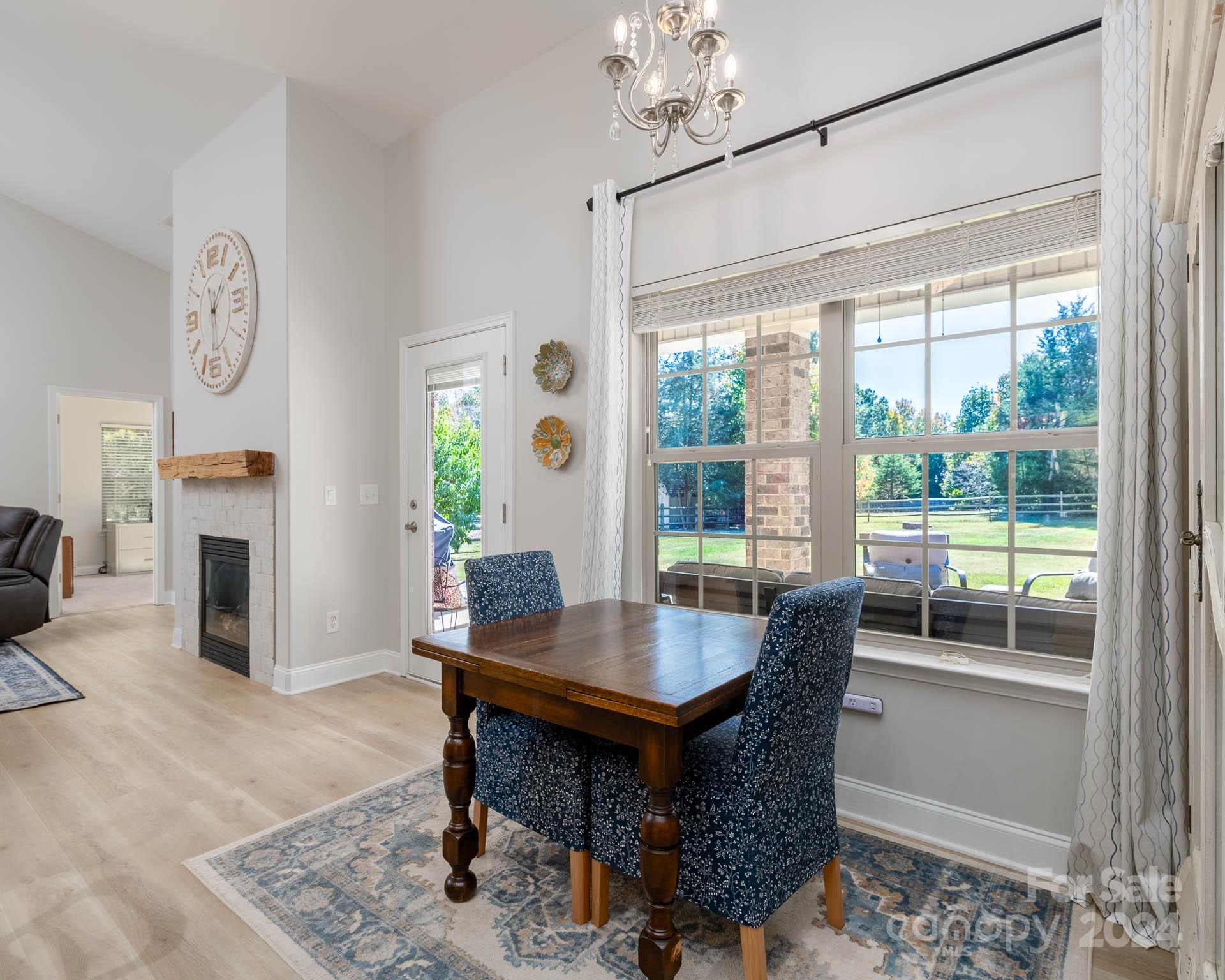 706 Houston Road Troutman, NC 28166 - Photo 20 of 39 a view of a dining room with furniture window and wooden floor