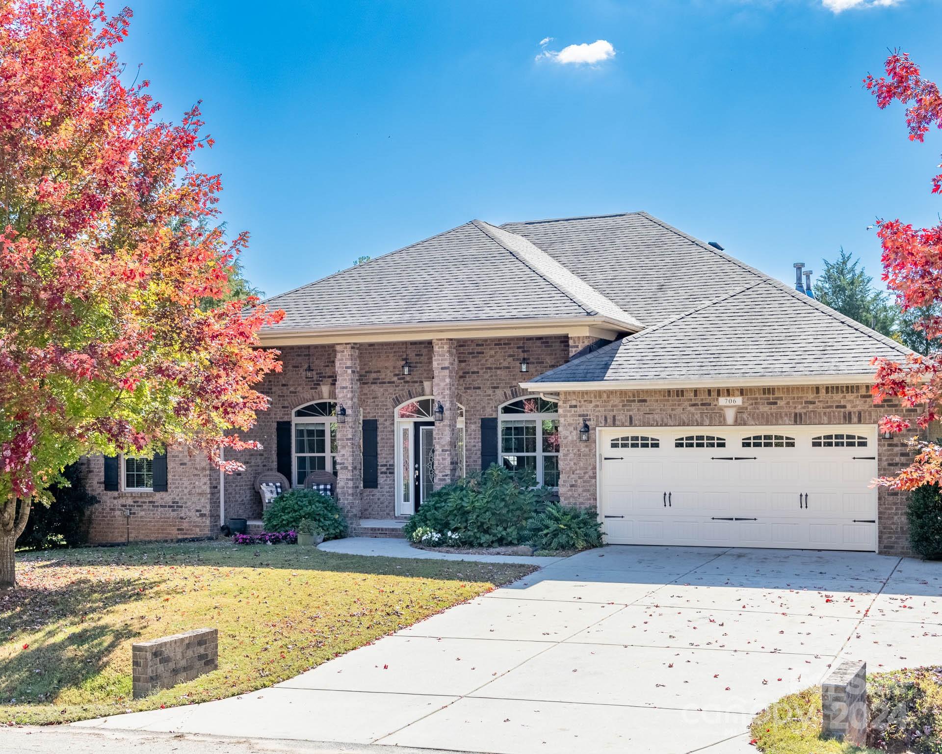 706 Houston Road Troutman, NC 28166 - Photo 2 of 39 a front view of a house with a yard