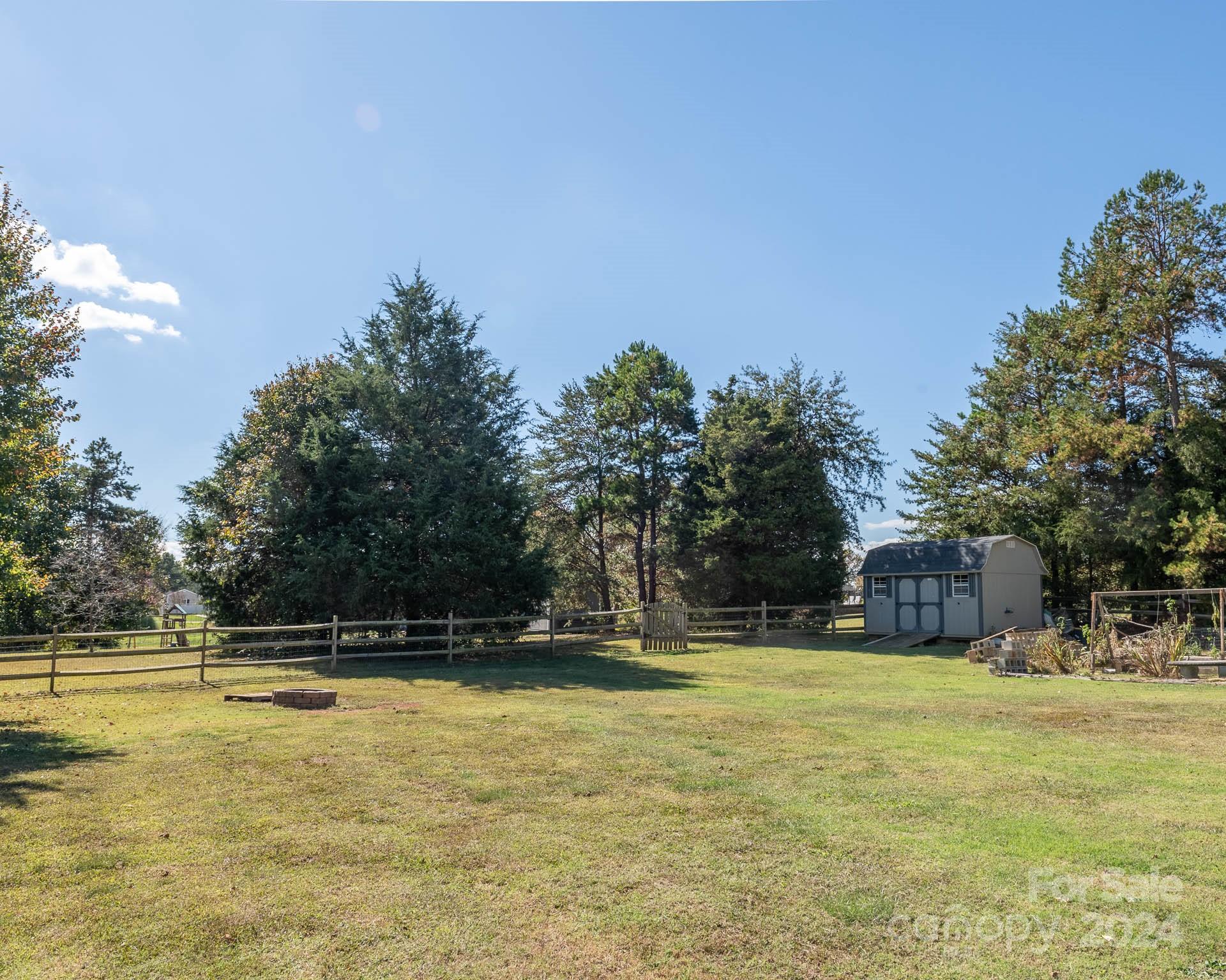706 Houston Road Troutman, NC 28166 - Photo 30 of 39 a view of swimming pool with an outdoor space and seating area