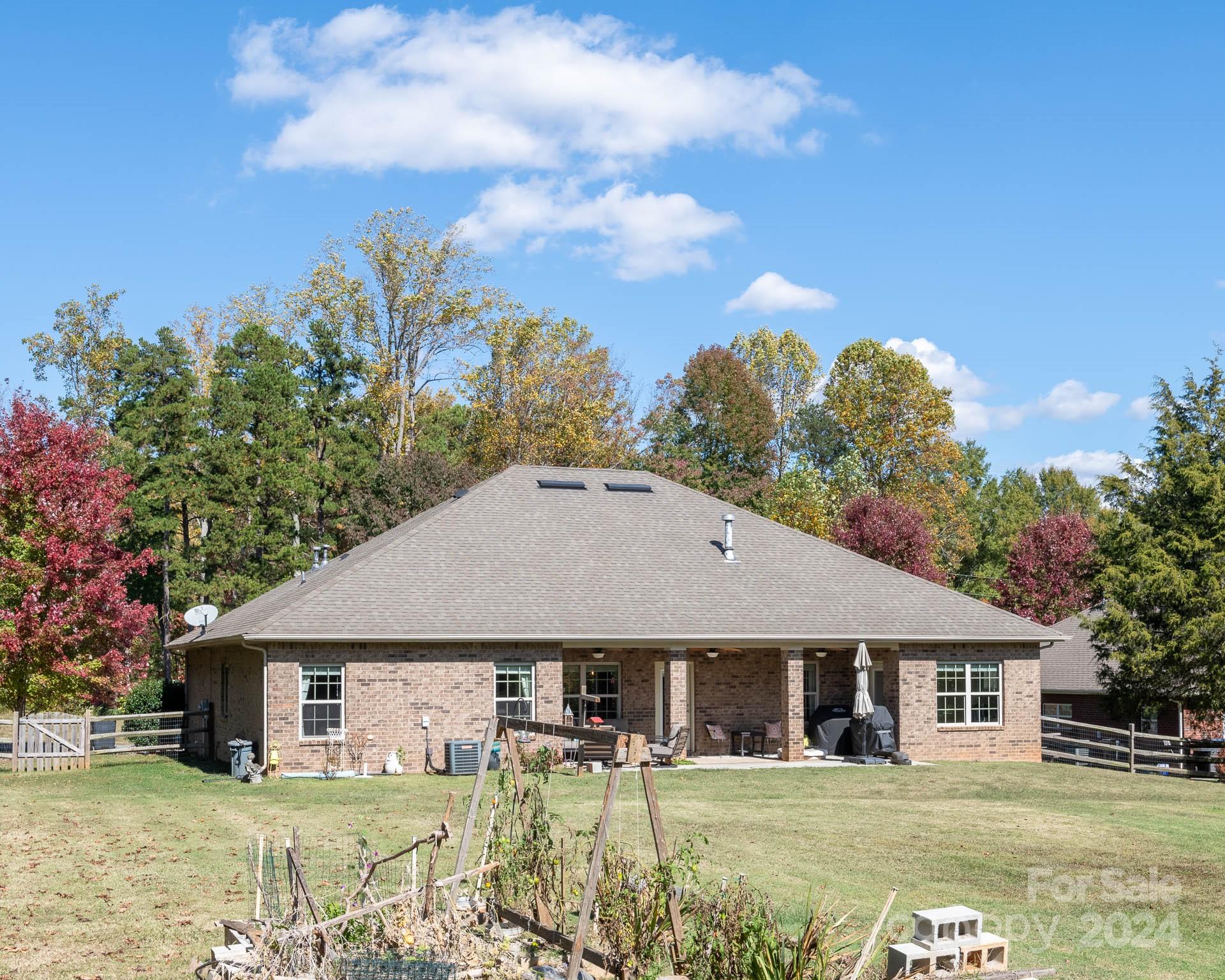 706 Houston Road Troutman, NC 28166 - Photo 33 of 39 a front view of a house with garden
