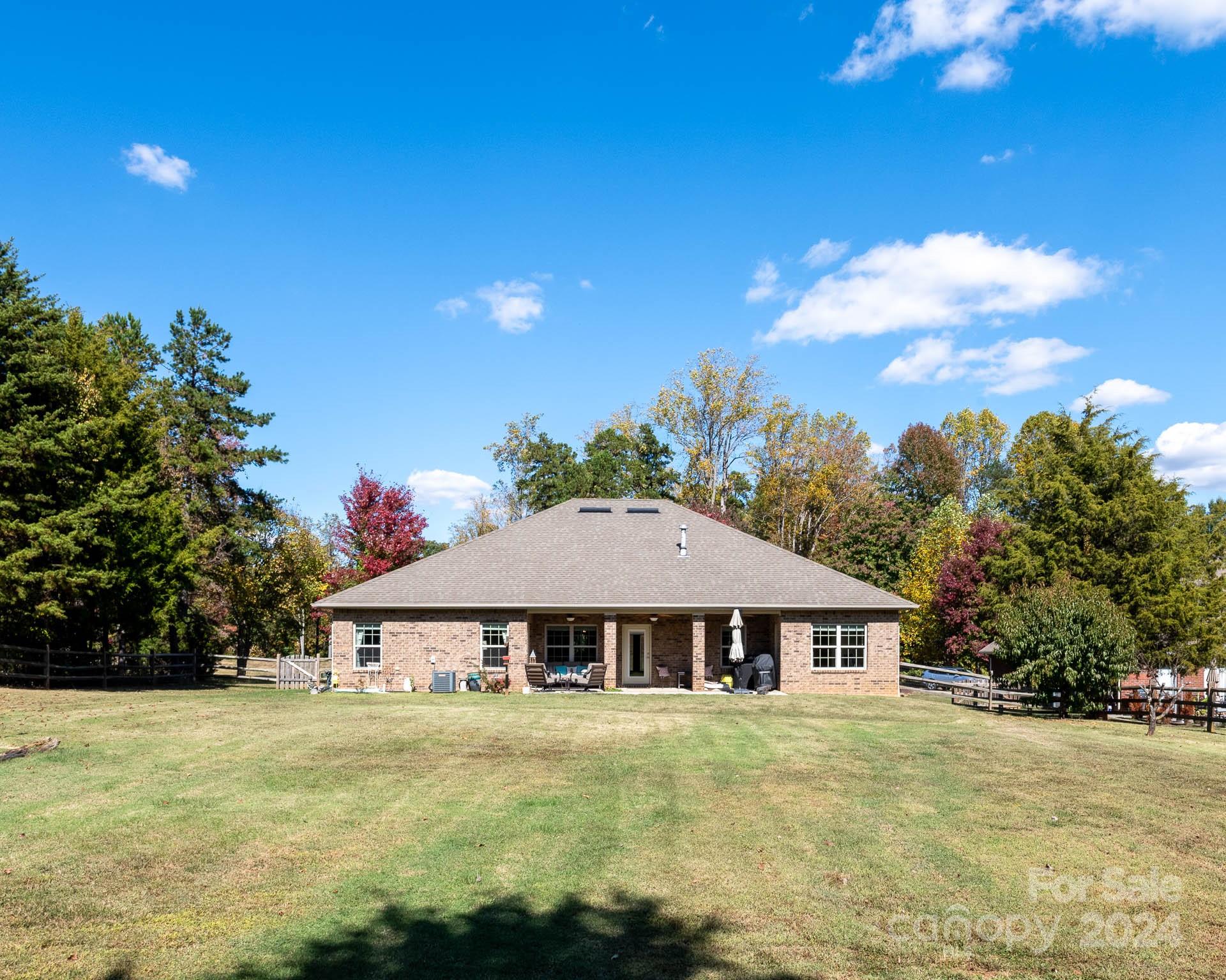 706 Houston Road Troutman, NC 28166 - Photo 34 of 39 a front view of a house with garden