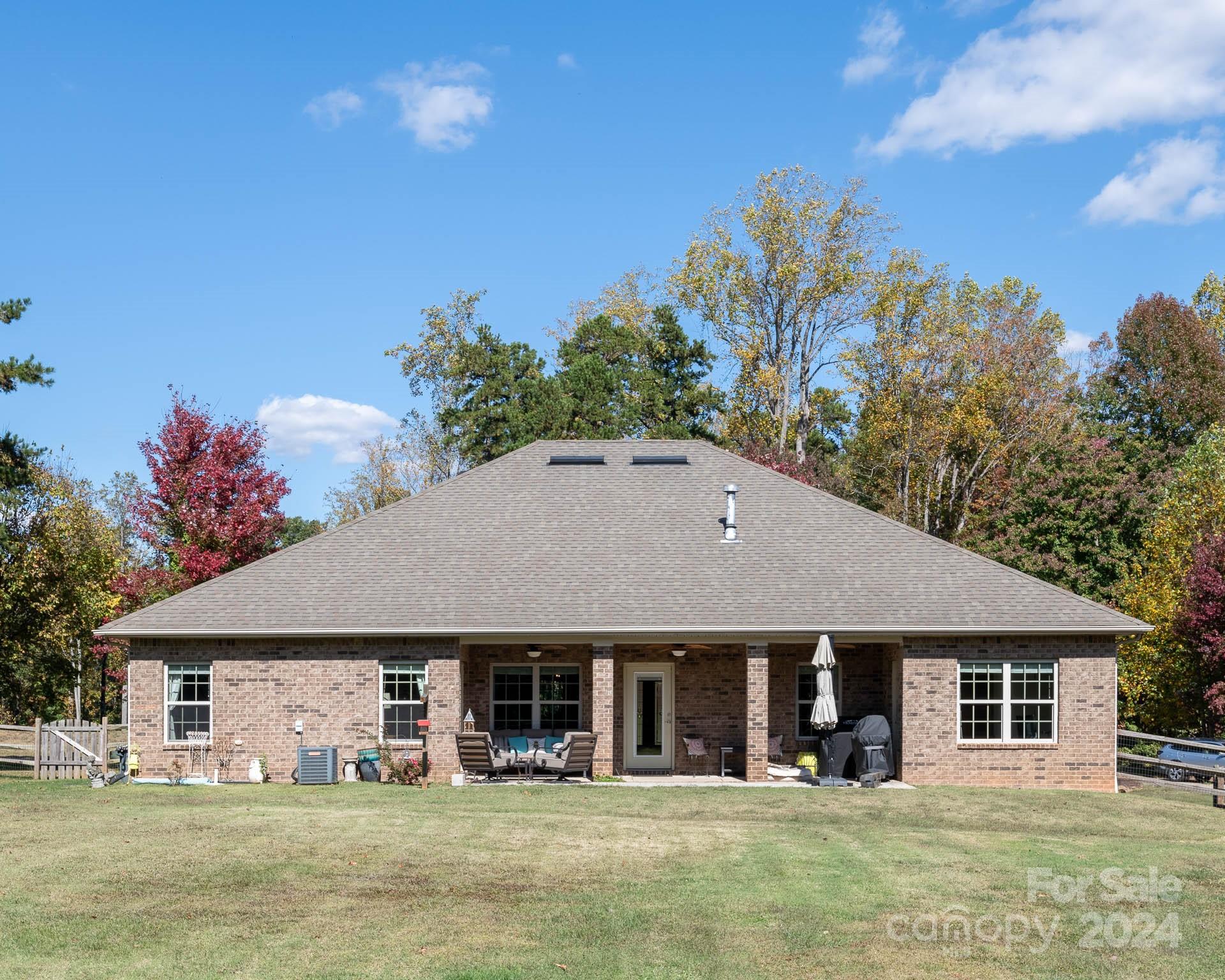 706 Houston Road Troutman, NC 28166 - Photo 35 of 39 a front view of a house with garden