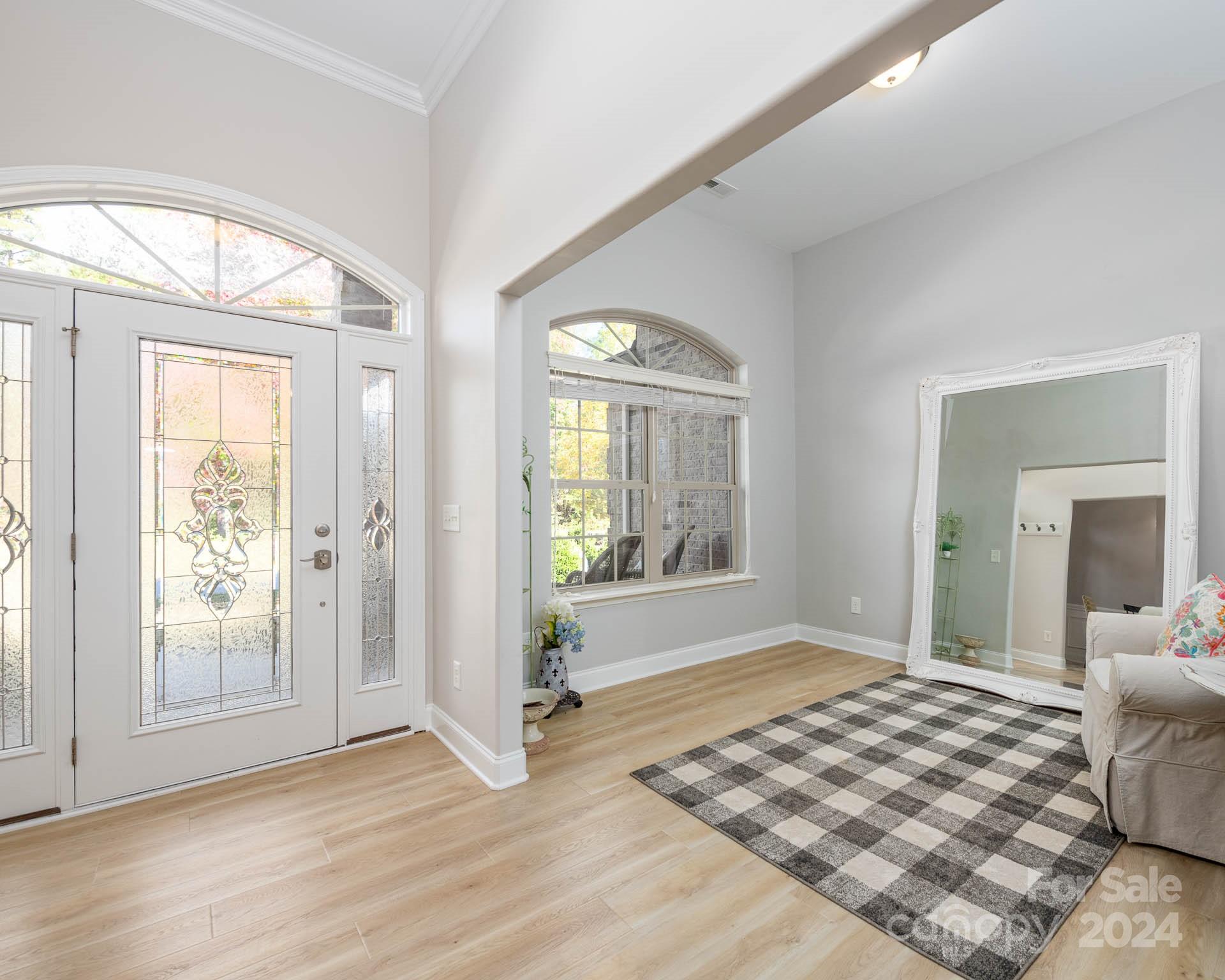 706 Houston Road Troutman, NC 28166 - Photo 7 of 39 a bedroom with a bed and a large window