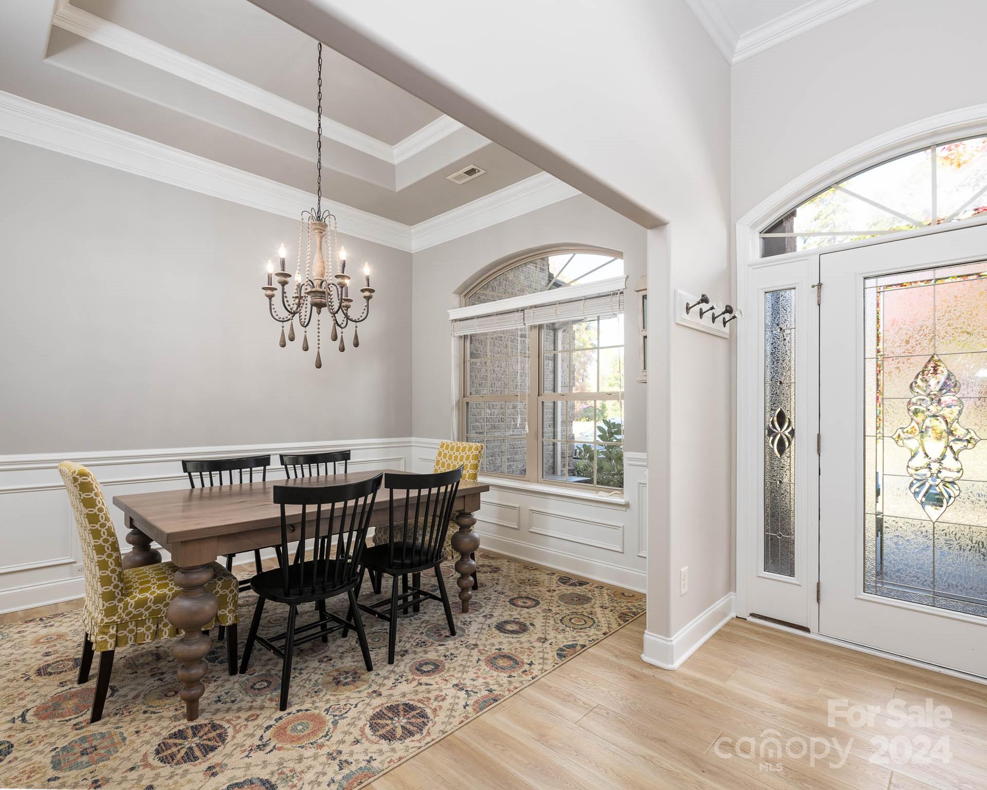 706 Houston Road Troutman, NC 28166 - Photo 8 of 39 a view of a dining room with furniture window and wooden floor