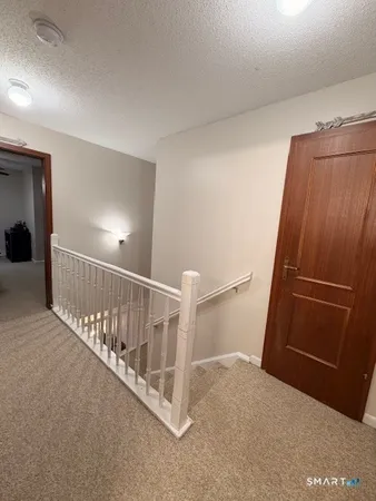 a living room with furniture a window and a flat screen tv