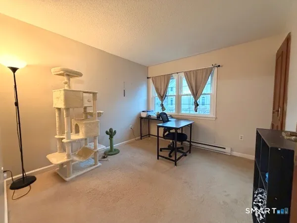 a spacious bedroom with a bed and a window