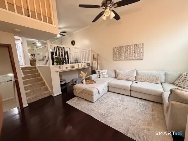 a living room with furniture and a flat screen tv