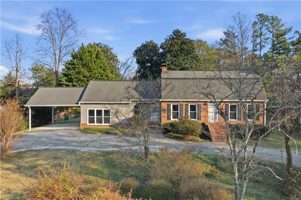 205 Hart Circle Dallas, GA 30132 - Photo 1 of 44 front view of house with a garden