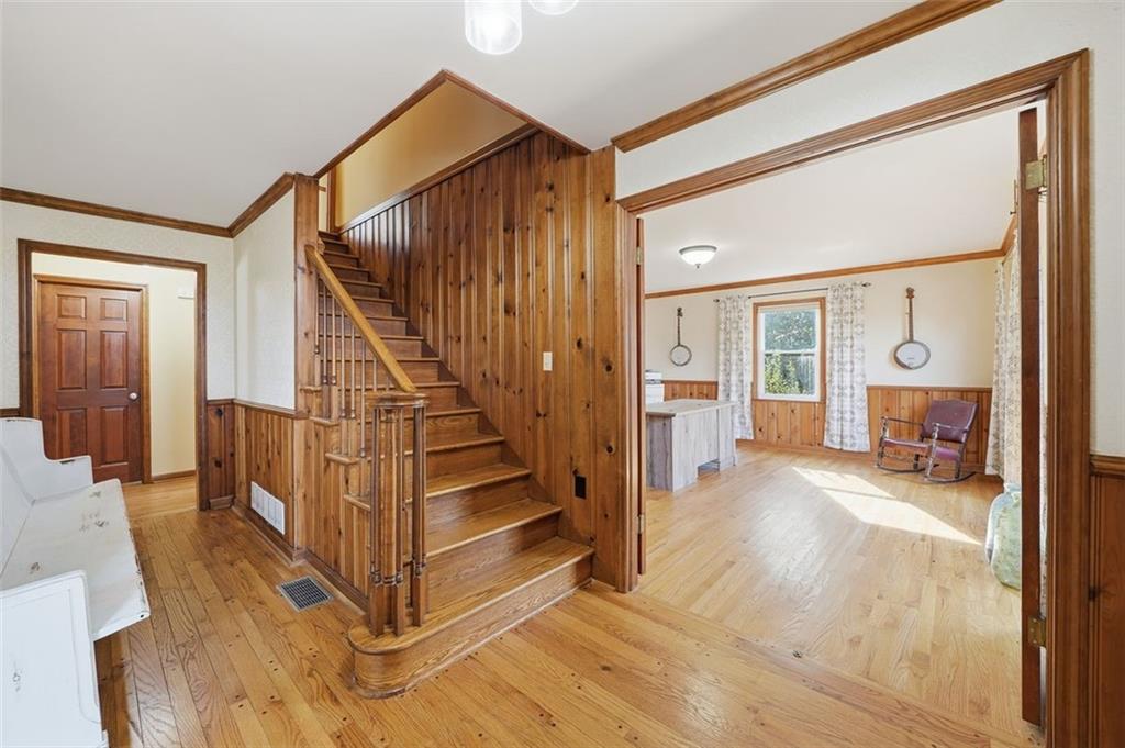 205 Hart Circle Dallas, GA 30132 - Photo 15 of 44 a view of a hallway with wooden floor and staircase