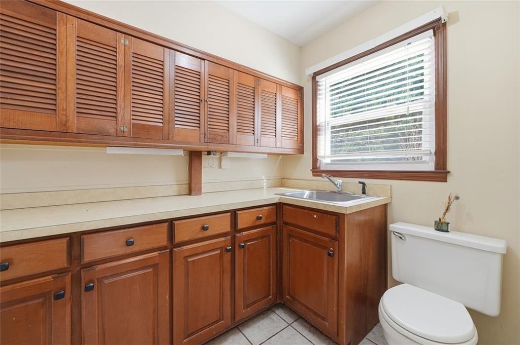 205 Hart Circle Dallas, GA 30132 - Photo 18 of 44 a bathroom with a sink a toilet and a window