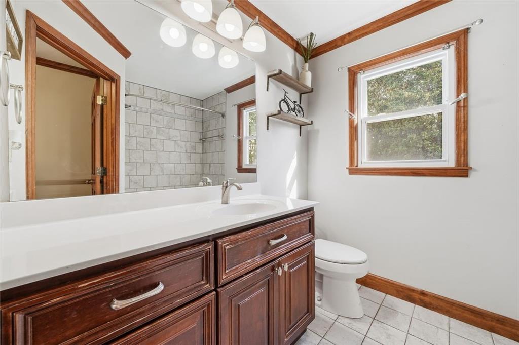 205 Hart Circle Dallas, GA 30132 - Photo 20 of 44 a bathroom with a granite countertop sink a toilet and a mirror