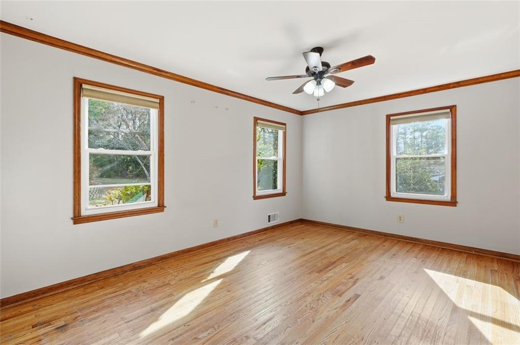 205 Hart Circle Dallas, GA 30132 - Photo 23 of 44 a view of an empty room with a window and a ceiling fan