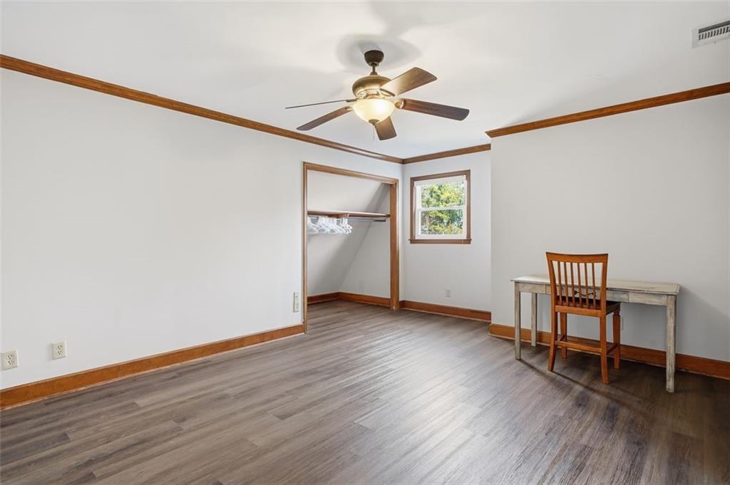 205 Hart Circle Dallas, GA 30132 - Photo 24 of 44 a view of an empty room with a window and wooden floor