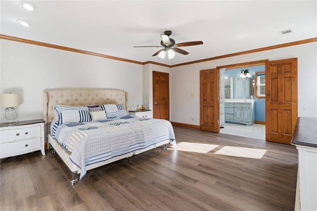 205 Hart Circle Dallas, GA 30132 - Photo 25 of 44 a bed room with a bed and a ceiling fan