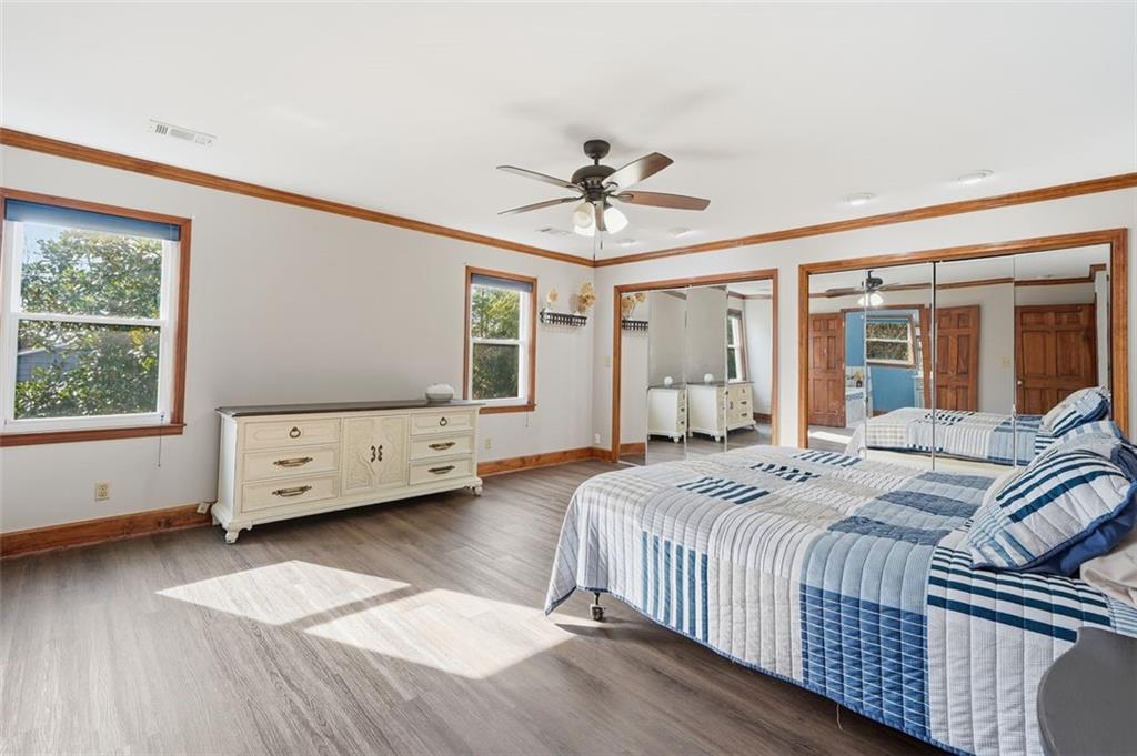 205 Hart Circle Dallas, GA 30132 - Photo 26 of 44 a bedroom with a bed and a chandelier