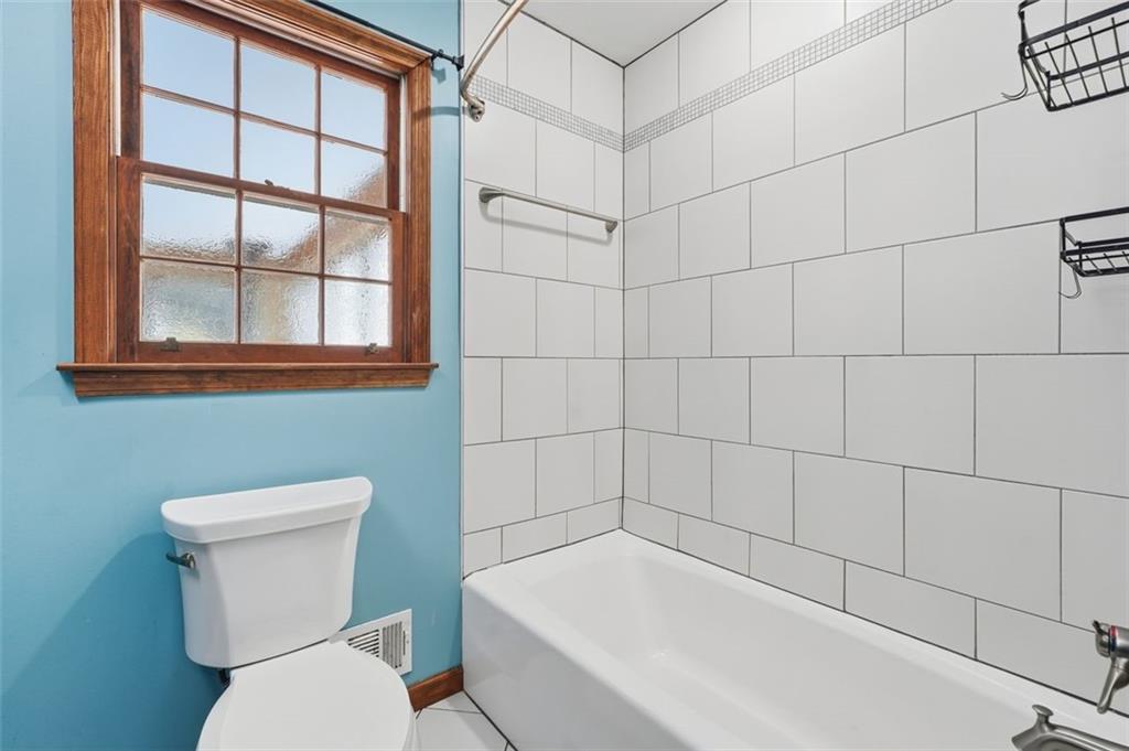 205 Hart Circle Dallas, GA 30132 - Photo 30 of 44 a white toilet sitting next to a bathroom sink