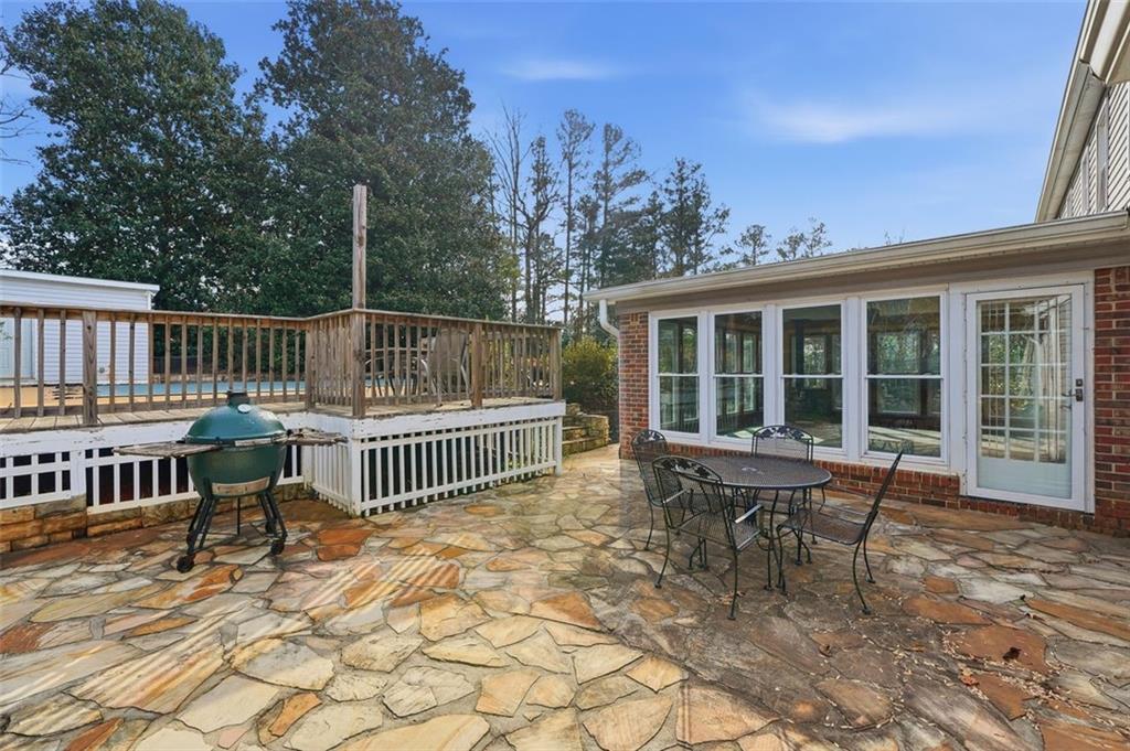 205 Hart Circle Dallas, GA 30132 - Photo 31 of 44 a view of a chair and table on the deck