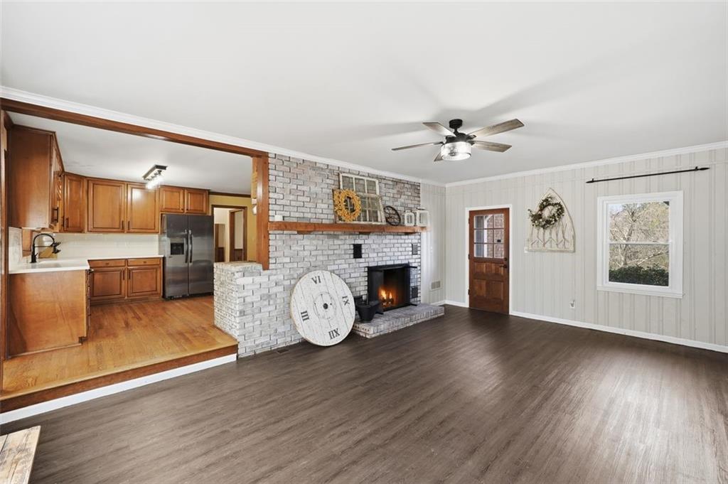 205 Hart Circle Dallas, GA 30132 - Photo 5 of 44 a view of a livingroom with furniture a ceiling fan and wooden floor