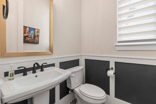 2432 Rose Run Way Celina, TX 75009 - Photo 14 of 26 a bathroom with a sink and a toilet