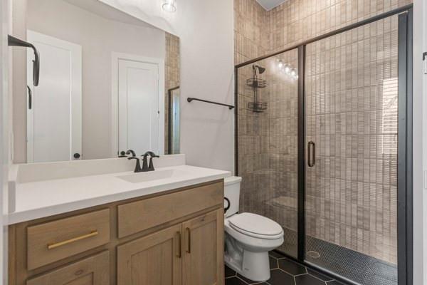 2432 Rose Run Way Celina, TX 75009 - Photo 21 of 26 a bathroom with a sink toilet and shower