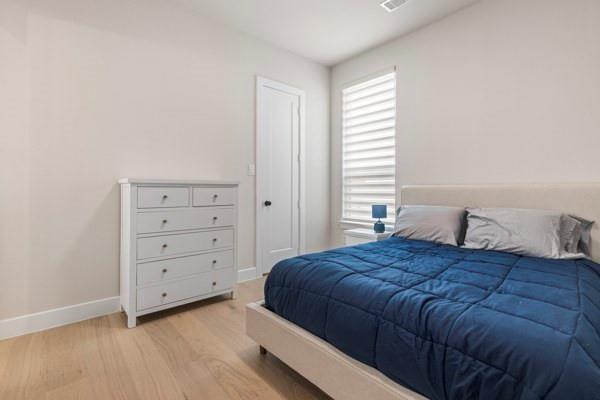 2432 Rose Run Way Celina, TX 75009 - Photo 22 of 26 a bedroom with a bed and a window