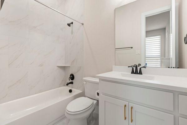2432 Rose Run Way Celina, TX 75009 - Photo 23 of 26 a bathroom with a sink a toilet and a bathtub