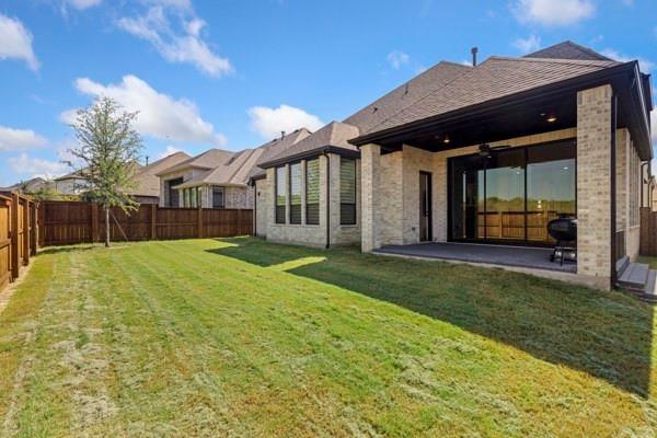 2432 Rose Run Way Celina, TX 75009 - Photo 26 of 26 a view of a house with backyard and porch