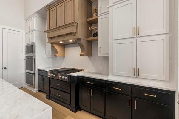 2432 Rose Run Way Celina, TX 75009 - Photo 5 of 26 a kitchen with stainless steel appliances granite countertop a sink stove and refrigerator