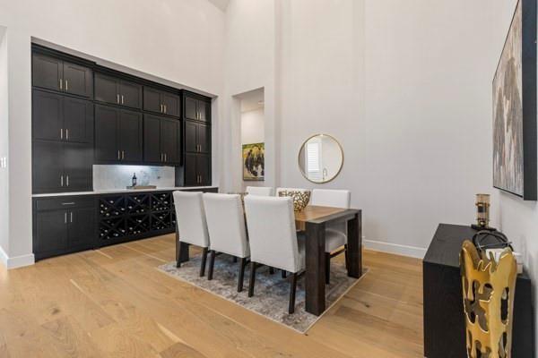 2432 Rose Run Way Celina, TX 75009 - Photo 8 of 26 a kitchen with a table chairs and a refrigerator