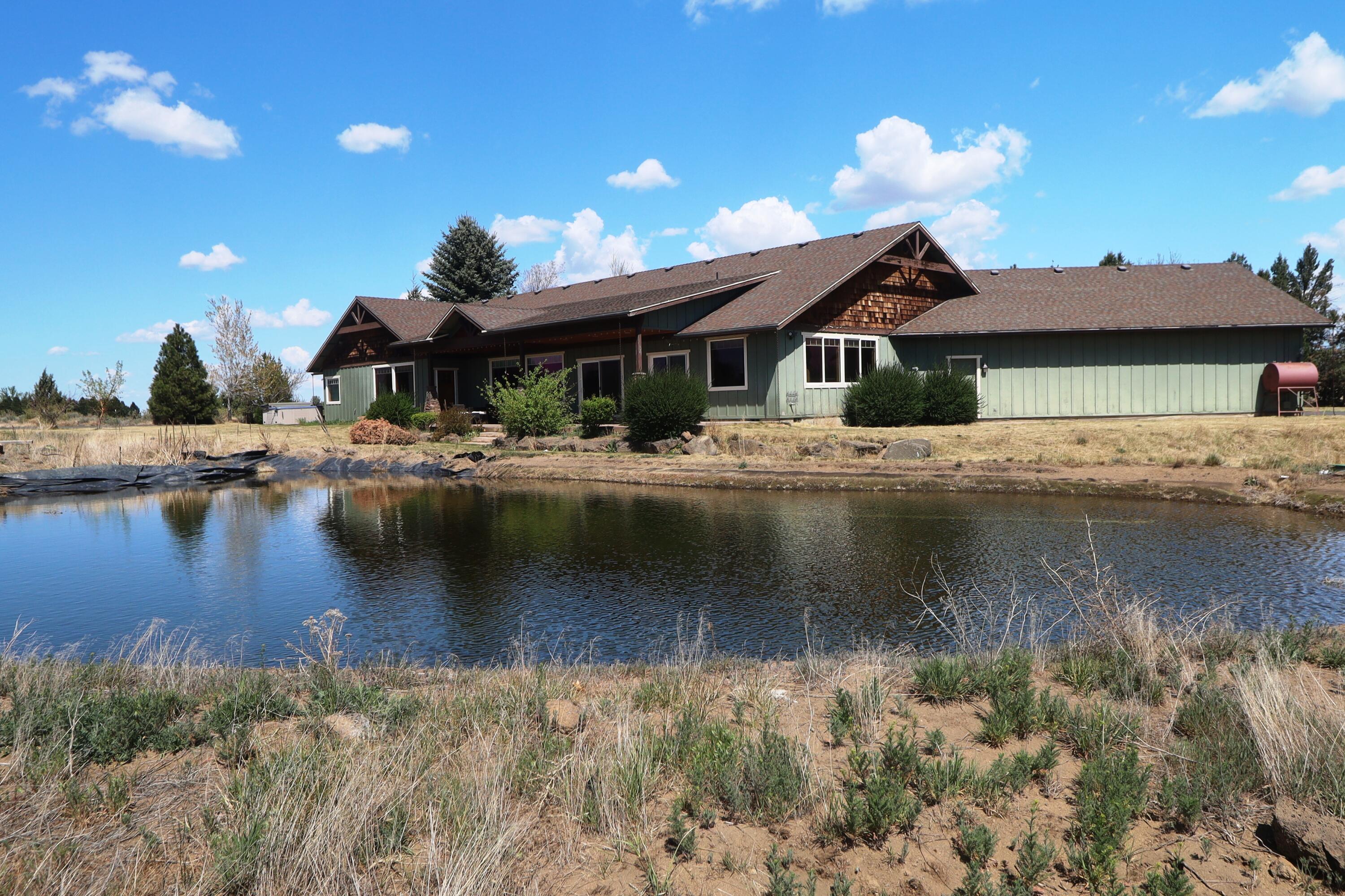 21491 Bear Creek Road Bend, OR 97701 - Photo 3 of 45 a view of a house with a lake view