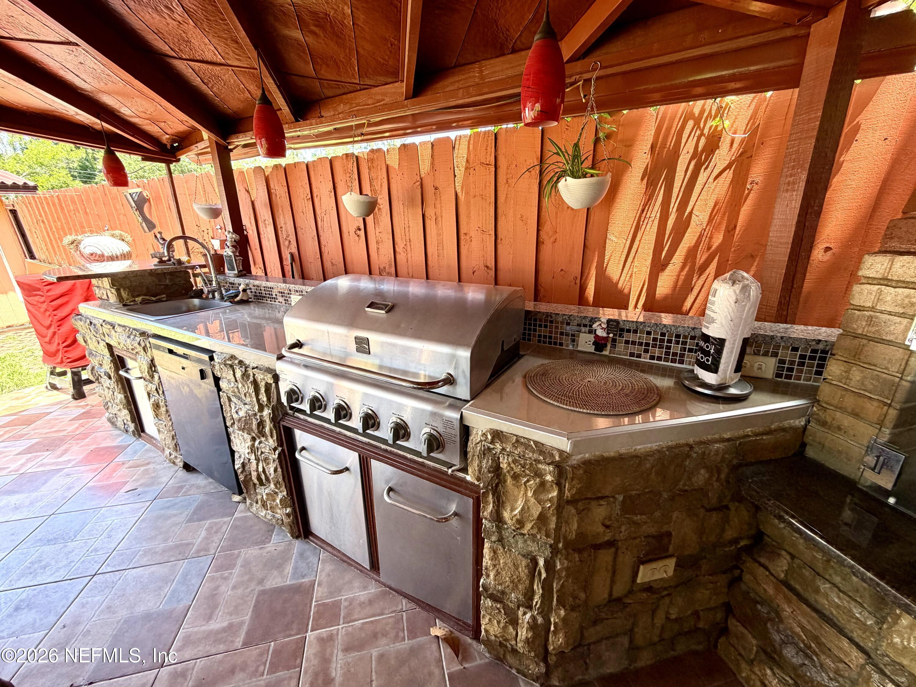 4127 Springwood Road Jacksonville, FL 32207 - Photo 45 of 63 a kitchen with a stove and a sink