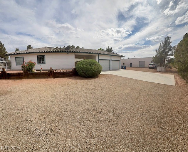 10561 Rancho Destino Road Las Vegas, NV 89183 - Photo 4 of 29 View of front of home with concrete driveway and an attached garage