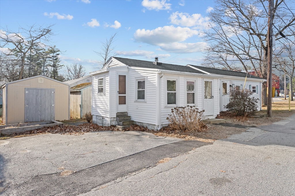 194 Lafayette Road, Unit 2E Salisbury, MA 01952 - Photo 20 of 23 a front view of a house with a yard