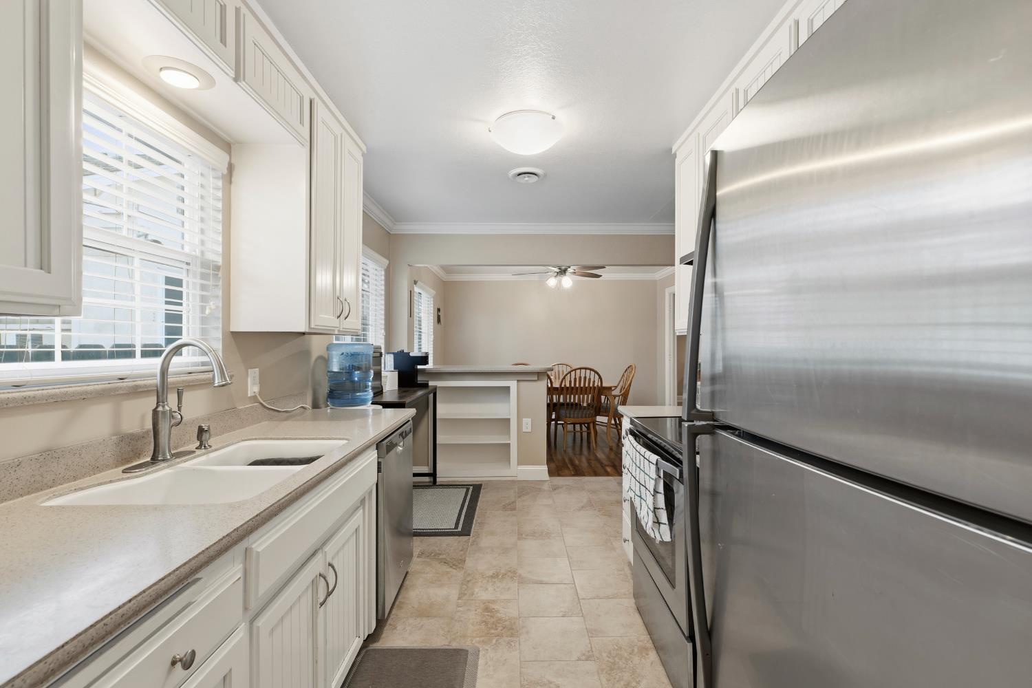 550 Bell Street Turlock, CA 95380 - Photo 12 of 36 a kitchen with a refrigerator and a sink