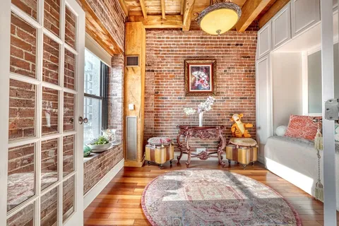 a view of a living room and a large window