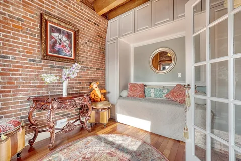 a bedroom with furniture and a window