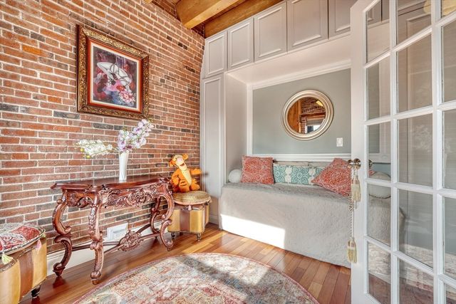 a bedroom with furniture and a window