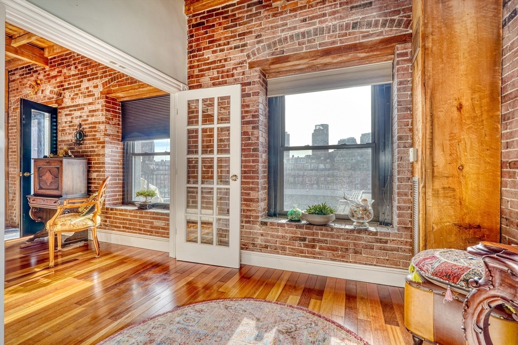 28-32 Atlantic Avenue, Unit 424 Boston, MA 02110 - Photo 18 of 38 a view of a living room and a large window