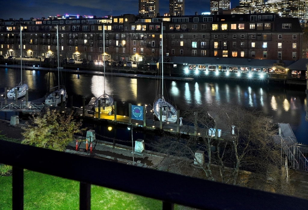 28-32 Atlantic Avenue, Unit 424 Boston, MA 02110 - Photo 3 of 38 a room with lots of bottles of alcohol