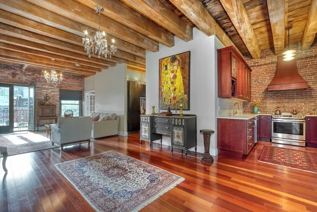 a view of hallway with wooden floor