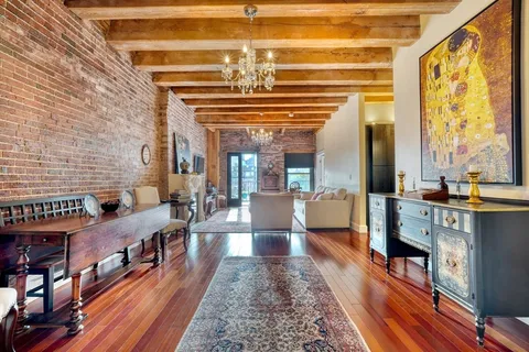 a kitchen with stainless steel appliances granite countertop a sink and wooden cabinets