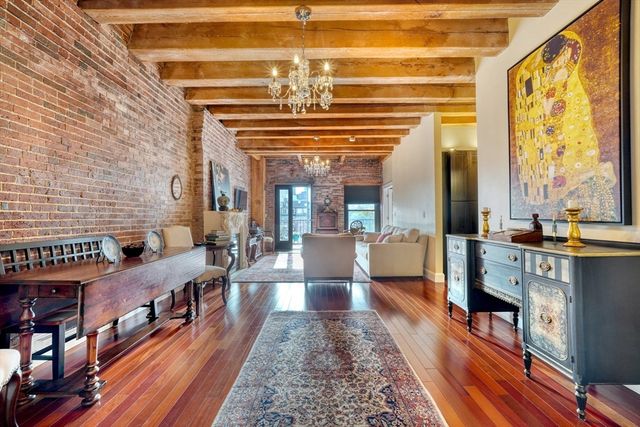 a kitchen with stainless steel appliances granite countertop a sink and wooden cabinets